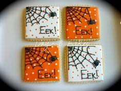 four decorated cookies with spider webs on them are arranged in the shape of squares