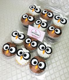 some cupcakes with frosting decorated like owls