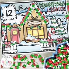 a christmas themed counting lights activity with candy in the foreground and an image of a gingerbread house