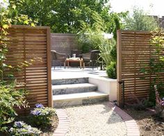 an outdoor patio area with steps and landscaping