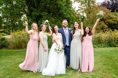 a group of people that are standing in the grass