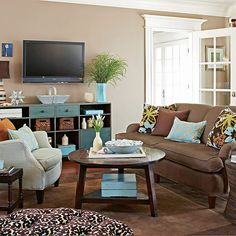 a living room filled with furniture and a flat screen tv