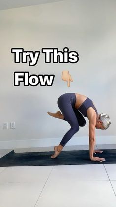 a woman doing a yoga pose with the words try this flow above her