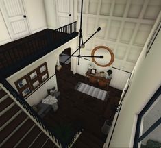 an aerial view of a living room and staircase