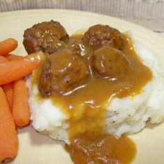 meatballs and gravy on mashed potatoes with carrots