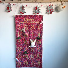 a red door decorated with christmas decorations and bunnies