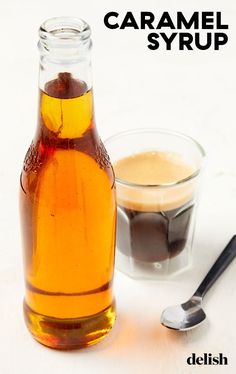 a bottle of caramel syrup next to a spoon