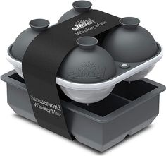 two black and white containers with lids on each one that has a black ribbon around it