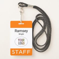 a lanyard with a name tag attached to it on a white background and an orange label that says, ramsey wright your logo