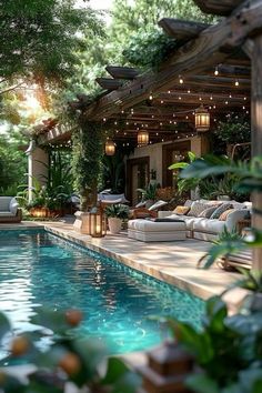 an outdoor living area with a pool and patio furniture in the foreground, surrounded by greenery