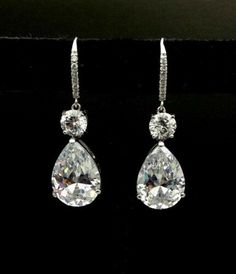 "𝐃𝐞𝐬𝐜𝐫𝐢𝐩𝐭𝐢𝐨𝐧 : *Pear With Round Moissanite Diamond Dangle earring, Leverback Earring For Women, Dangle & Drop Earring, 925 Sterling Silver Teardrop Earring. Let's Design Your Jewelry with Moissanite. Moissanite is a gemstone that looks a lot like a diamond. It possesses fire, brilliance, and lustre more than that of a diamond. It is not a fake diamond. ❖ 𝐃𝐢𝐚𝐦𝐨𝐧𝐝 𝐃𝐞𝐭𝐚𝐢𝐥𝐬 *Color : White *Clarity : VVS *Cut : Excellent *Shape : Pear *Stone Size : 1.50, 5.80, 14*10 MM *Total Luxury Brilliant Cut Teardrop Earrings, Affordable Drop Shape Matching Earrings Jewelry, Luxury White Gold Diamond Cut Teardrop Earrings, Luxury Classic Brilliant Cut Teardrop Earrings, Luxury Classic Teardrop Earrings With Brilliant Cut, Luxury Sterling Silver Pear-shaped Teardrop Earrings, Luxury Teardrop Brilliant Cut Earrings, Luxury Sterling Silver Teardrop Diamond Necklace, Luxury Silver Teardrop Earrings With Brilliant Cut