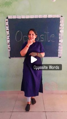 a woman standing in front of a blackboard with the words opposite words written on it