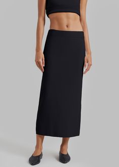 Color: Black Midweight Milano knit fabric Regular fit 
 Midi length
 Elasticated waist Slip-on style Unlined 58% Viscose 41% Polyamide 1% Elastane Machine Wash Cold By The Frankie Shop. Imported The Frankie Shop, Knit Pencil Skirt, Frankie Shop, Pencil Skirt Black, Midi Length, Knit Fabric, Pencil Skirt, Knitted Fabric, Slip On