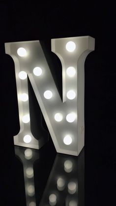 the letter n is lit up with lights