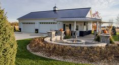 a house with a fire pit in the front yard