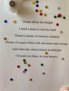 a poem written in white paper with stars on it