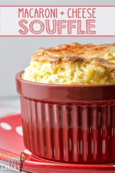 a red casserole dish filled with food on top of a white and red plate