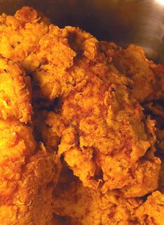 some fried food is in a metal bowl