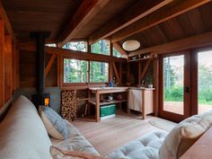 a living room filled with furniture and windows