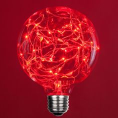 a red light bulb that has been turned on and is lit up with fairy lights