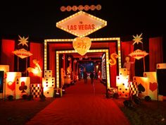 the entrance to las vegas is lit up at night with lights and decorations on it