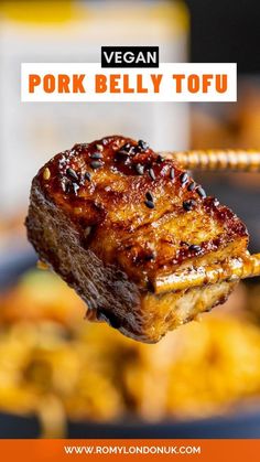 a piece of meat is being held up with the words vegan pork belly tofu above it