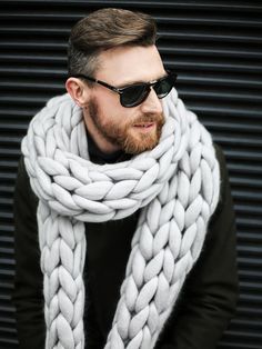 "Marshmallow Oversized Scarf Knitting Pattern + Video Make sure you stand out in the crowd. Go bold with this flashy and fashionable chunky knit scarf. This scarf is 92\" (2.3 m) long and 10\" (25 cm) wide. You'll need approximately three pounds (1,5 kg) of merino wool roving. We recommend using 21 microns merino wool or less for knitwear projects. These instructions were created with total novices in mind. You can use them to successfully make a Marshmallow Oversized Scarf even if you've never arm-knitted in your life. These illustrated instructions and video tutorial will take you through each step of arm knitting. All our free tutorials https://ohhio.com Instagram @ohhio https://www.instagram.com/ohhio/ Youtube @ohhio https://www.youtube.com/c/Ohhio Pinterest @ohhiodesign https://www.pi Super Chunky Blanket, Knitted Decor, Chunky Knit Scarf, Scarf Knitting Pattern, Chunky Knit Scarves, Chunky Knitting, Diy Scarf, Scarf Knitting, Wool Roving