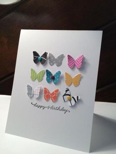 a birthday card with colorful butterflies on it