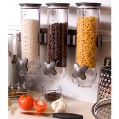 the food dispenser is hanging on the wall above the kitchen counter top