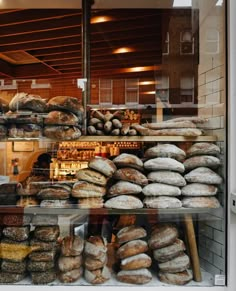 a bakery filled with lots of different types of bread