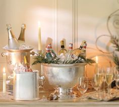 a table topped with champagne bottles and glasses