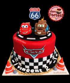 a birthday cake with cars on the top