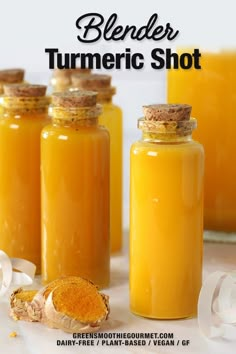 three jars filled with yellow turment sitting next to each other