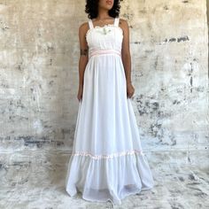 "Vintage 1970s Candi Jones maxi dress White with a cute floral embroidery and lace detail Empire waist with sash tie Fits size XS/S Measurements laid flat -Bust: 17\" -Waist: 13\" -Length: 59\" In excellent vintage condition *Model is 5'2\"/Bust 33\"/Waist 26\"/Typically wears XS/S* **Wearing 4in platforms in this photo**" 1970s Style White Maxi Dress, 1970s White Maxi Length Dresses, 1970s White Maxi Dress, Maxi Dress White, Embroidered Maxi Dress, White Maxi Dresses, Dress Clothes For Women, Vintage 1970s, Empire Waist