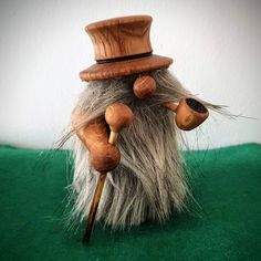 an odd looking toy made to look like a man's hat and canes