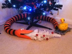 the cat in the hat is laying on the floor next to his toy ducky