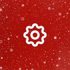 a red background with white snowflakes and a circular object in the center on top