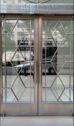 an open glass door on the side of a building