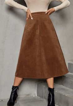 The EMES SHOP skirt is detailed with a gorgeous A-line silhouette. Features solid color. high waist. corduroy material. and mid-calf length. Pair it with a turtleneck and ankle boots for a chic look.MATERIAL:95% Polyester 5% ElastaneMEASUREMENTS: Product Length 30"-31.5"in 4-6-Small | Waist: 25"-26.5"in | Hips: 33.5"-35"in 6-8-Medium | Waist: 26.5"-28"in | Hips: 35"-36.5"in 8-10-Large | Waist: 28"-29.5"in | Hips: 36.5"-38"in 10-12-X-Large | Waist: 29.5"-31"in | Hips: 39.5"-41"in MEASUREMENTS: Pr Winter A-line Solid Color Bottoms, Winter A-line Bottoms In Solid Color, Brown Solid Color Skirt For Fall, Corduroy Skirt For Winter, Corduroy Lined Skirt Bottoms For Fall, High Waist Corduroy Skirt For Fall, Corduroy Skirt For Fall Workwear, High-waist Corduroy Skirt For Fall, Fall Corduroy Skirt For Workwear