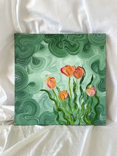 an acrylic painting of some flowers on a white sheet with green swirls