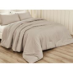 the comforter is made up and ready for someone to use it in their bed