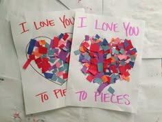 two pieces of paper that have been made to look like hearts and the words i love you