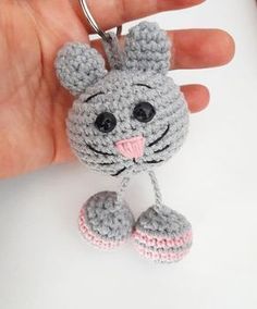 a crocheted keychain shaped like a mouse