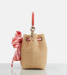 Find JIMMY CHOO Bon Bon Raffia Bucket Bag on Editorialist. The Jimmy Choo Bon Bon Raffia Bucket Bag is crafted from raffia and features a top handle, a shoulder strap, and a drawstring closure. It is lined with fabric and made in Italy. Raffia Bucket Bag, Candy Pink, Bon Bon, Seasonal Fashion, Jimmy Choo, Bucket Bag, Top Handle, Shoulder Bags, Shoulder Strap