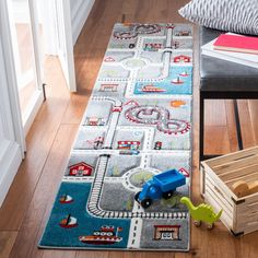 a child's rug with cars and trains on it