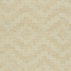 a beige rug with an abstract design on the top and bottom part of it's surface