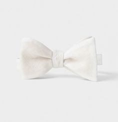 Classic White Bow As Gift, Classic White Bow For Black Tie Occasions, White Classic Bow Tie, Classic White Bow Ties, Classic White Bow With Ties, Classic White Standard Tie Bow, Classic White Bow Tie, White Satin Bow Tie, Elegant White Adjustable Bow Tie