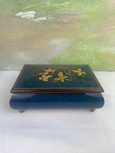 a blue and gold box sitting on top of a table