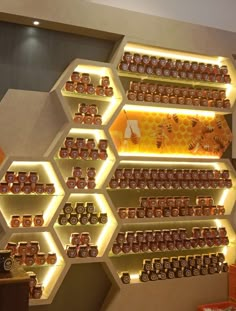 the shelves are filled with honeycombs and jars