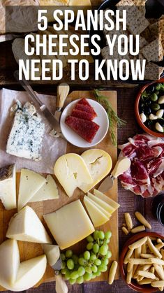 cheeses and other foods are arranged on a cutting board with the words, 5 spanish cheeses you need to know